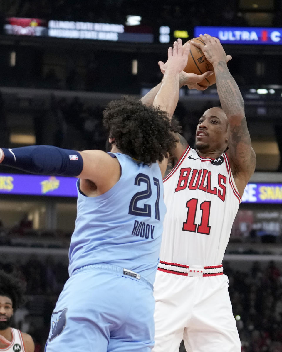 Chicago Bulls' DeMar DeRozan (11) shoots over Memphis Grizzlies' David Roddy during the first half of an NBA basketball game Saturday, Jan. 20, 2024, in Chicago. (AP Photo/Charles Rex Arbogast)