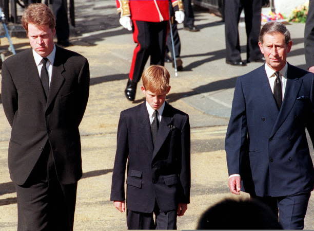 Earl Spencer, Diana’s brother, Prince Harry, her son, and Prince Charles, her former husband, join the gun carriage carrying the coffin of Princess of Wales at Marlboro Road in London during the funeral (AFP via Getty Images)