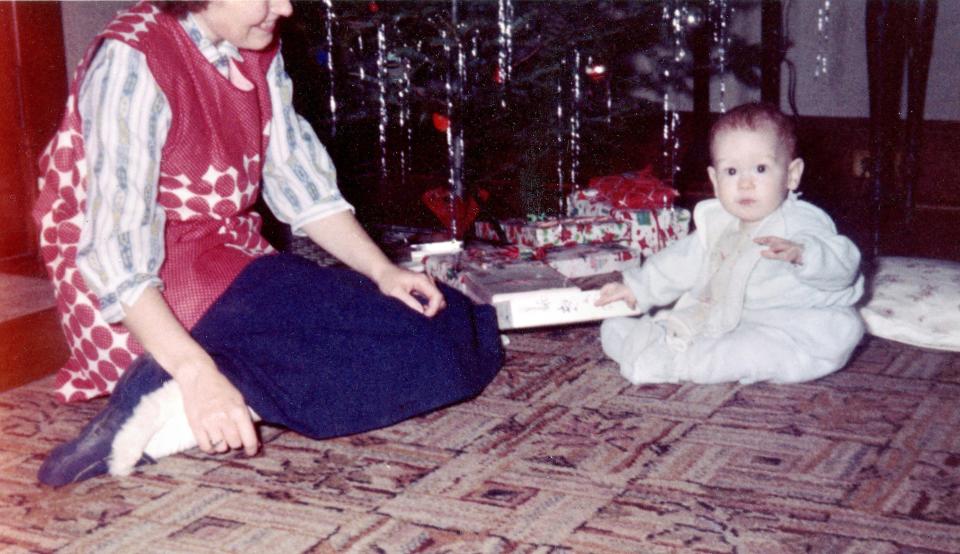 Vintage Kodachrome slide from Christmas 1958 when the old Kodak camera viewfinder didn't always see quite what the lens did as a budding photojournalist enjoys the presents under the tree. (John Heaslip/Cape Cod Times).