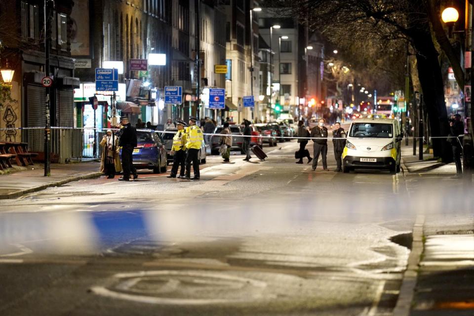 A large police cordon is in place on Saturday evening (PA)