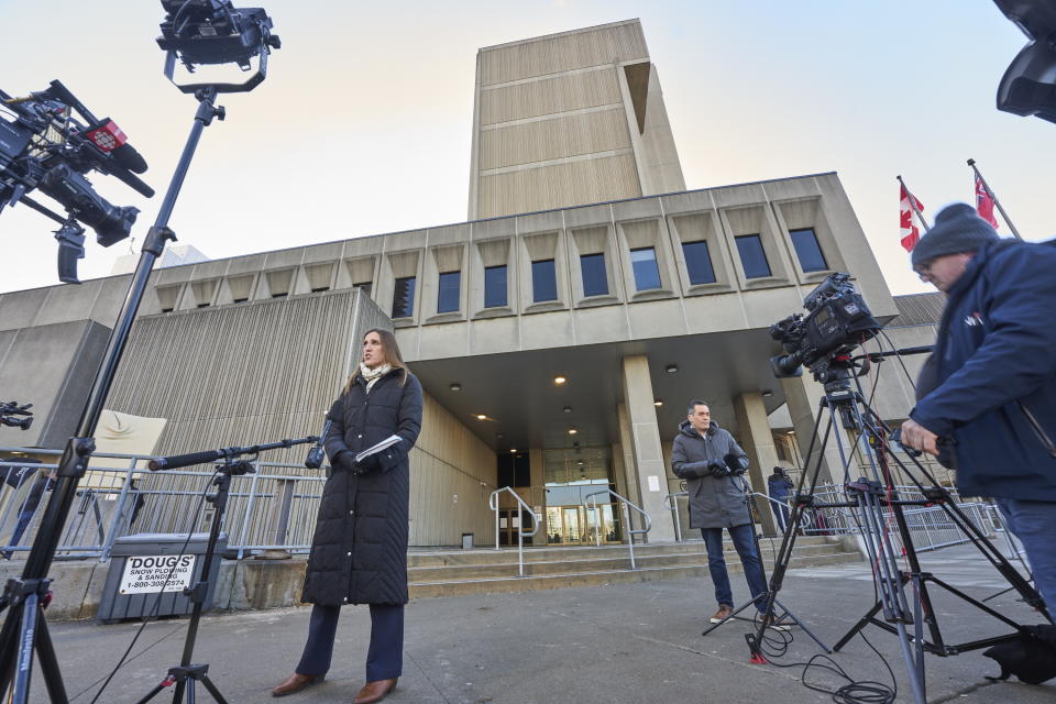 Media gather in front of the courthouse in London, Ontario on Monday, Feb. 5, 2024. The sexual assault case against five former members of Canada's world junior hockey team will return to court at the end of April. (Geoff Robins/The Canadian Press via AP)