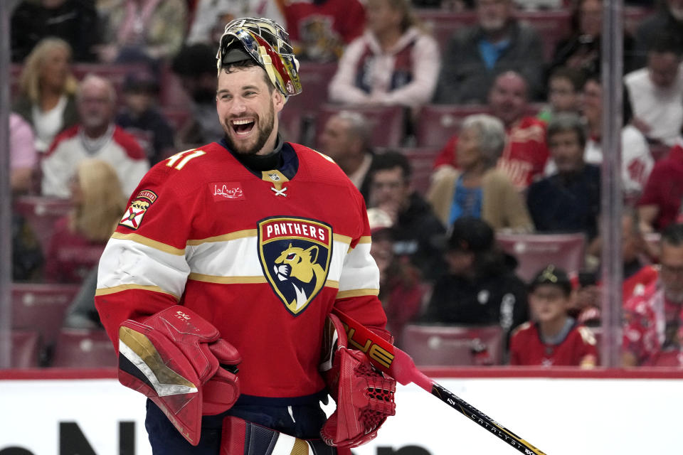 Florida Panthers goaltender Anthony Stolarz smiles after it was announced he was playing in his 100th NHL game. during the first period of the team's hockey game against the Montreal Canadiens, Thursday, Feb. 29, 2024, in Sunrise, Fla. (AP Photo/Lynne Sladky)