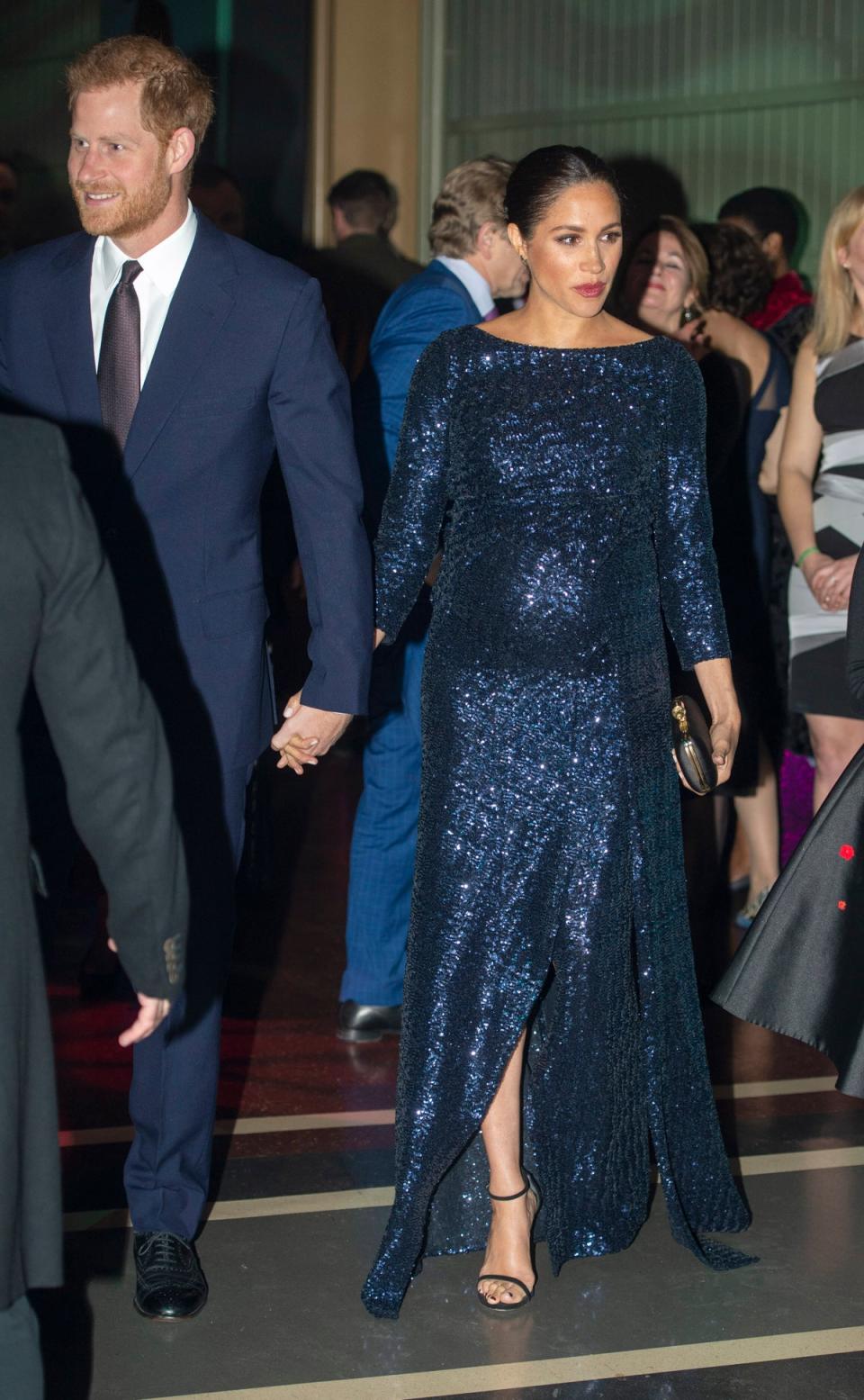 The Duke and Duchess of Sussex hold hands outside the Royal Albert Hall in London (Getty Images)