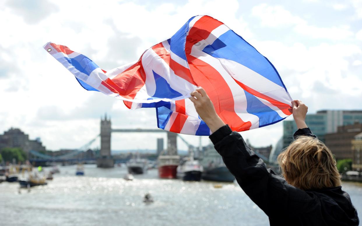 A leave supporter is seen as fishing boats campaigning for Brexit sail down the Thames through central London, United Kingdom on June 15, 2016.  - 2016 Anadolu Agency