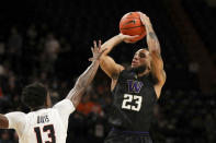 Washington's Terrell Brown Jr. (23) shoots over Oregon State's Dashawn Davis (13) during the first half of an NCAA college basketball game Thursday, Jan. 20, 2022, in Corvallis, Ore. (AP Photo/Amanda Loman)