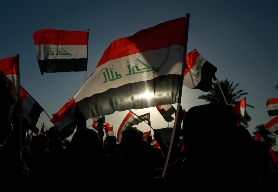 Followers of a political movement called "Al-Fateh Alliance" chant during a rally before the parliamentary elections in Baghdad, Iraq, Thursday, Oct. 7, 2021. Iraq on Sunday, Oct. 10, holds its fifth election since the 2003 U.S.-led invasion that toppled Iraqi dictator Saddam Hussein, with most Iraqis longing for real change. (AP Photo/Hadi Mizban)