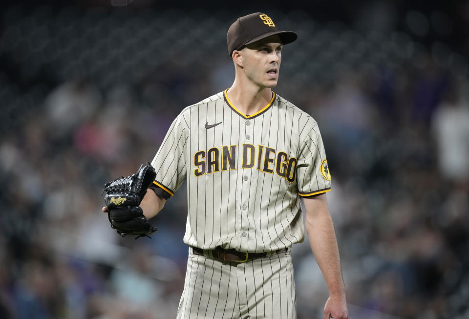 San Diego Padres relief pitcher Taylor Rogers reacts after getting Colorado Rockies' C.J. Cron to ground out to end the ninth inning of a baseball game Monday, July 11, 2022, in Denver. (AP Photo/David Zalubowski)