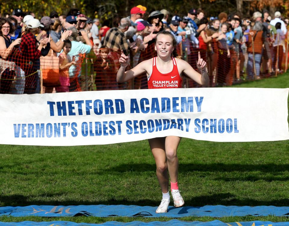 Alice Kredell cross the line in first place during the Division I high school girls cross-country running state championships at Thetford Academy on Saturday.