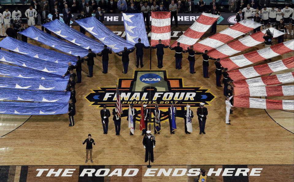 The flag is displayed during the national anthem before the finals of the Final Four NCAA college basketball tournament, Monday, April 3, 2017, in Glendale, Ariz. (AP Photo/Morry Gash)