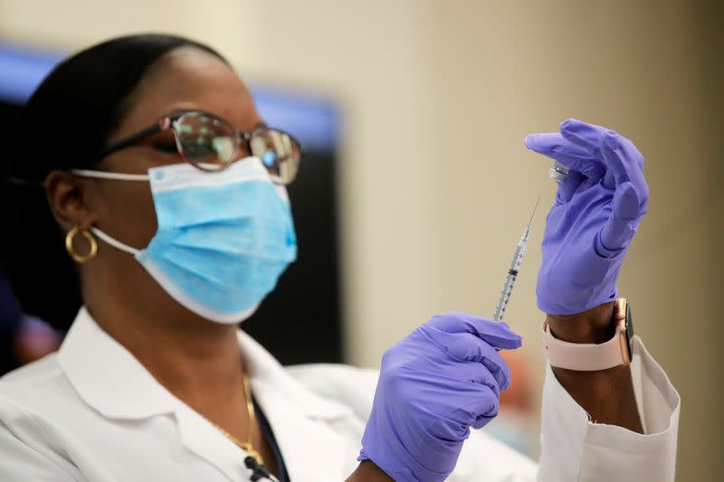 Health Care workers from Northwell Health receive the Pfizer COVID-19 vaccine