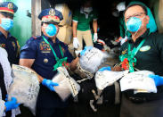 <p>Philippine National Police (PNP) Chief Director General Ronald Dela Rosa and Philippine Drug Enforcement Agency (PDEA) Director General Isidro Lapena (Right), display to the members of the media plastic bags full of methamphetamine hydrochloride, locally known as Shabu, during the destruction of confiscated illegal drugs at a waste management facility in Trece Martires town, Cavite, south of Manila on July 14, 2016. (REUTERS/Romeo Ranoco) </p>