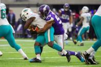 FILE PHOTO: Dec 16, 2018; Minneapolis, MN, USA; Minnesota Vikings defensive lineman Danielle Hunter (99) tackles Miami Dolphins running back Frank Gore (21) in the first quarter at U.S. Bank Stadium. Mandatory Credit: Brad Rempel-USA TODAY Sports - 11855934