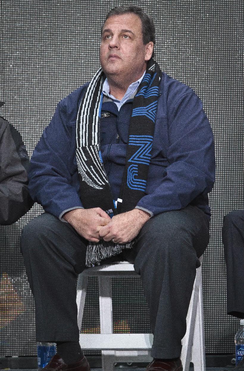 New Jersey Gov. Chris Christie waits for the start of a ceremony to pass official hosting duties of next year's Super Bowl to representatives from Arizona, Saturday Feb. 1, 2014 in New York. Fellow Republicans are assessing the damage of new allegations that Gov. Christie knew about a traffic-blocking operation orchestrated by top aides. (AP Photo/Bebeto Matthews)