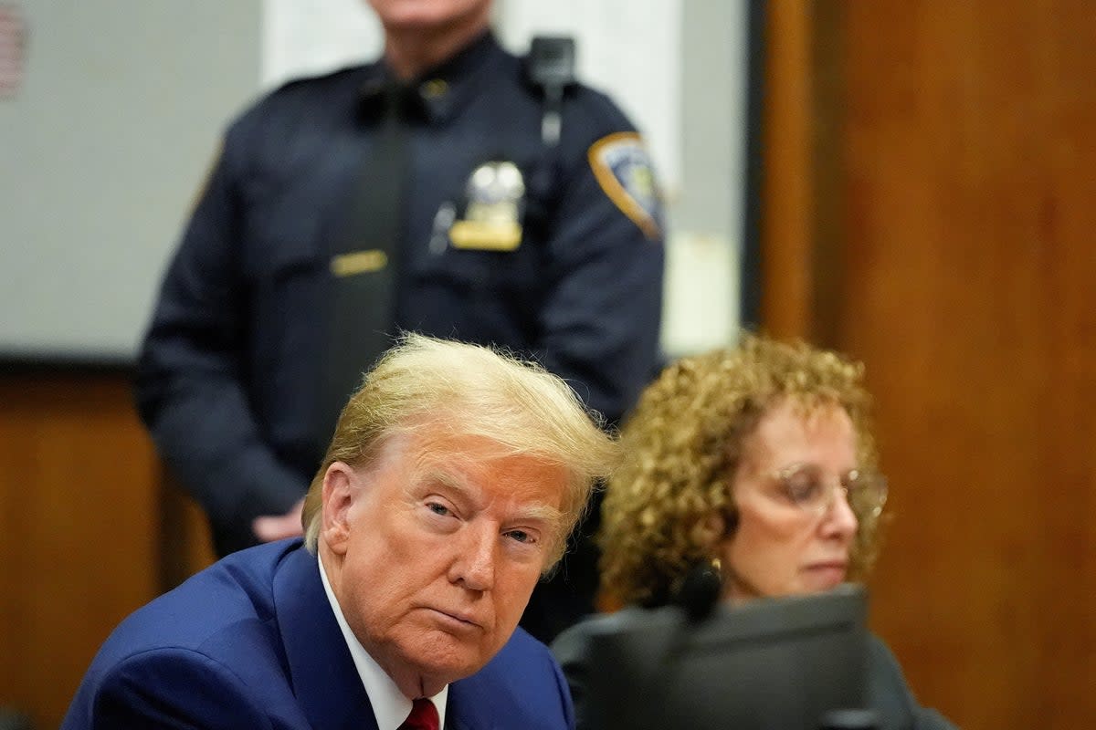 Donald Trump appears in a Manhattan criminal courtroom on 25 March (via REUTERS)