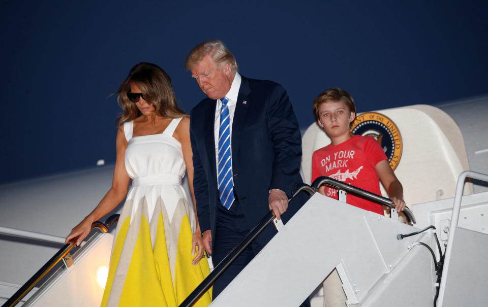 President Donald Trump arrives at Joint Base Andrews with his wife, Melania, and son Barron on Sunday. (Photo: Kevin Lamarque / Reuters)