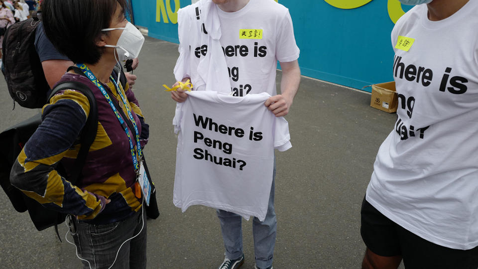 Melbourne based activists hand out 'Where is Peng Shuai?' t-shirts outside Rod Laver Arena before the Australian Open women's final. (Photo by James D. Morgan/Getty Images)