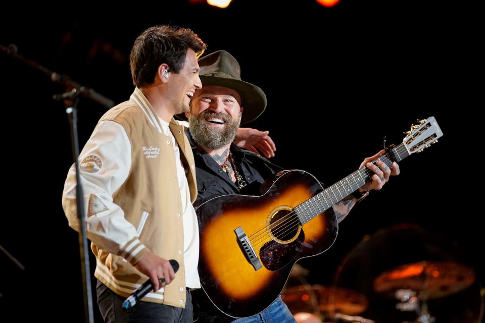 Simon Dumas of King Calaway embraces Zac Brown after they performed together during CMA Fest at Nissan Stadium Thursday, June 9, 2022 in Nashville, Tennessee.