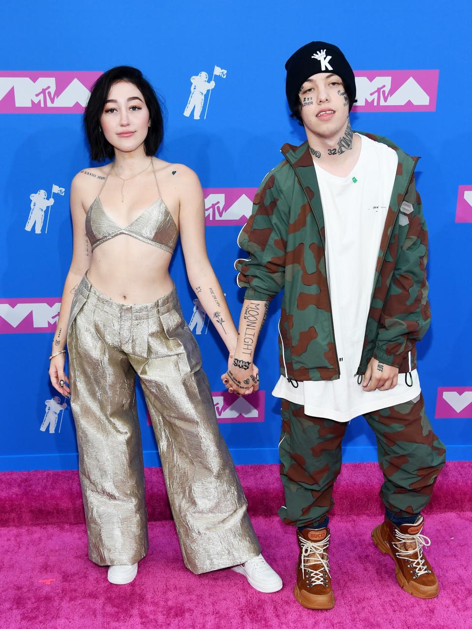 Noah turning heads in a bra as a top, while Lil Xan chose camo for the occasion.