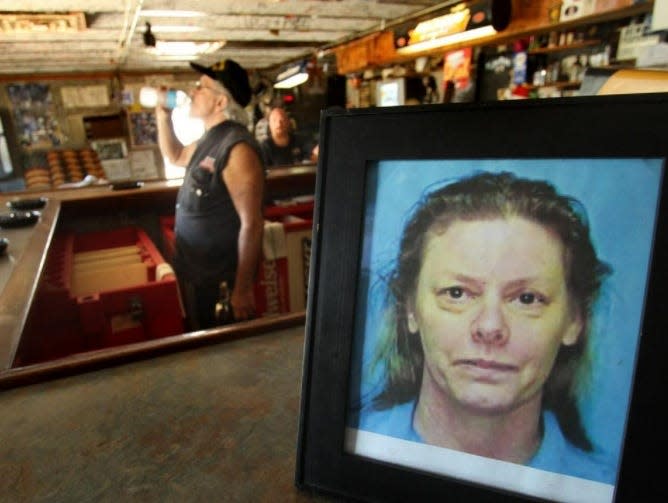 A framed photo of serial killer Aileen Wuornos sits on the counter at The Last Resort Bar in Port Orange. Bar owner Al Bulling has said the spirit of Wuornos, who was arrested there in 1991, has been present since her execution in October 2002.