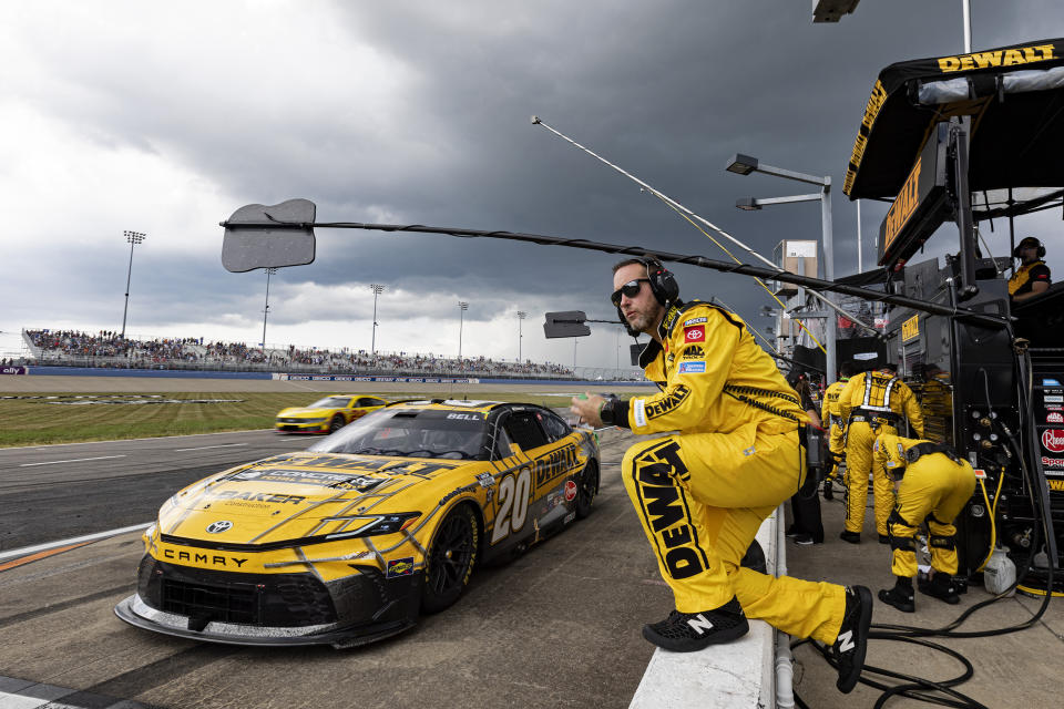 Christopher Bell (20) pulls into the pits as inclement weather moves in during a NASCAR Cup Series auto race, Sunday, June 30, 2024, in Gladeville, Tenn. (AP Photo/Wade Payne)