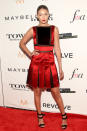 <p>Hadid looked put-together as always in a red satin mini dress with pleated skirt and black mesh panels—plus some dark red velvet for good measure. She smartly chose to wear her hair up in a sleek knot—considering the weather was erring on the wetter side. The finished things off with a matching red lip and strappy sandal heels.<br></p>