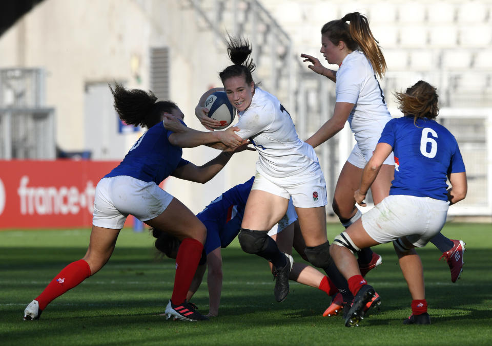 GRENOBLE, FRANCE - NOVEMBER 14: Emily Scarratt of England breaks through contact  during the France Women v England Women Autumn International series match at Stade des Alpes on November 14, 2020 in Grenoble, France. Sporting stadiums around France remain under strict restrictions due to the Coronavirus Pandemic as Government social distancing laws prohibit fans inside venues resulting in games being played behind closed doors.  (Photo by Chris Ricco - RFU/The RFU Collection via Getty Images)