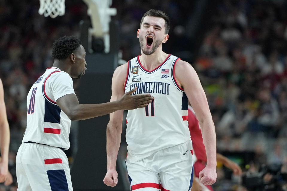 UConn forward Alex Karaban celebrates after a play against Alabama in an NCAA semifinal.