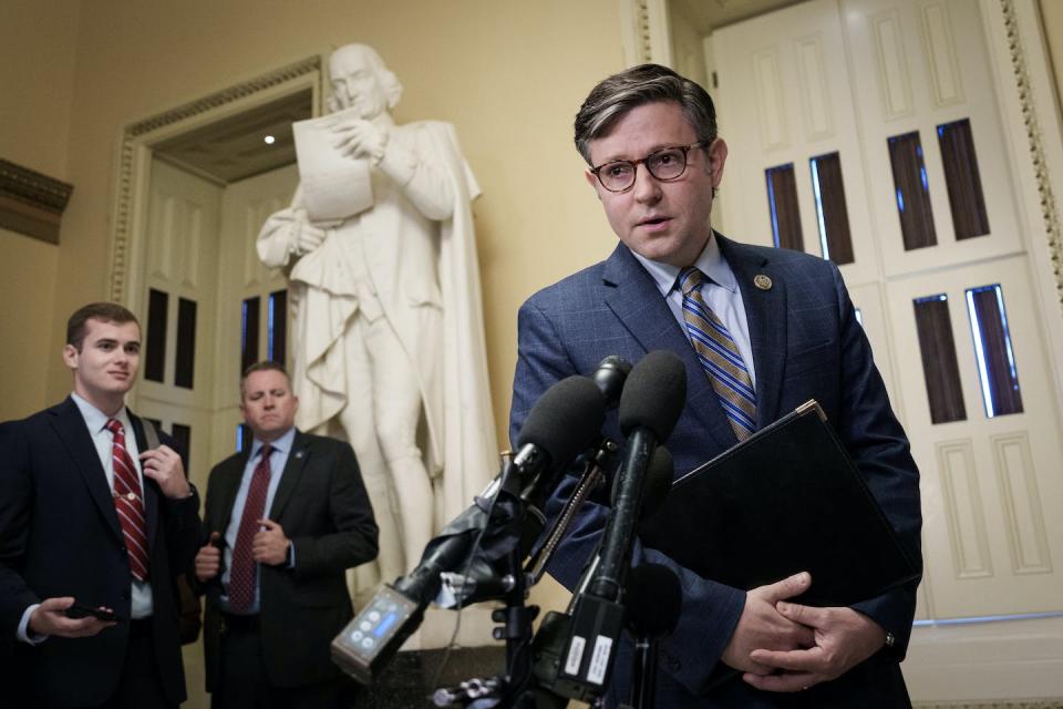 New House Speaker Mike Johnson, a Republican, will have to keep his GOP caucus happy while making a deal with Democrats to pass government funding. <a href="https://www.gettyimages.com/detail/news-photo/speaker-of-the-house-mike-johnson-gives-a-brief-statement-news-photo/1746072258?adppopup=true" rel="nofollow noopener" target="_blank" data-ylk="slk:Drew Angerer/Getty Images;elm:context_link;itc:0;sec:content-canvas" class="link ">Drew Angerer/Getty Images</a>