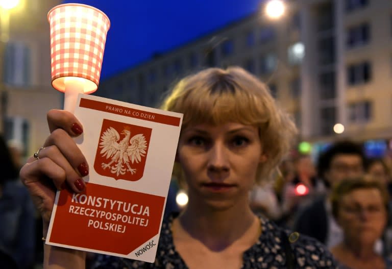 Protesters demonstrate in front of the Polish Supreme Court in Warsaw on July 23, 2017