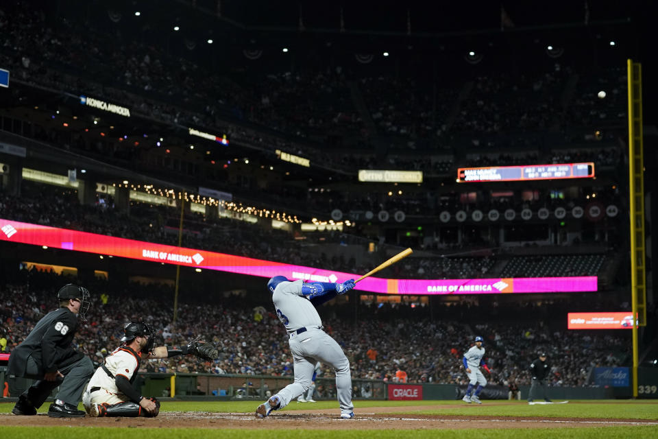 Los Angeles Dodgers' Max Muncy hits a three-run home run against the San Francisco Giants during the sixth inning of a baseball game in San Francisco, Wednesday, April 12, 2023. (AP Photo/Godofredo A. Vásquez)