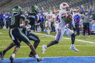 SMU running back Ulysses Bentley IV, right, scores a touchdown during the second half an NCAA college football game against Tulane in New Orleans, Friday, Oct. 16, 2020. (AP Photo/Matthew Hinton)