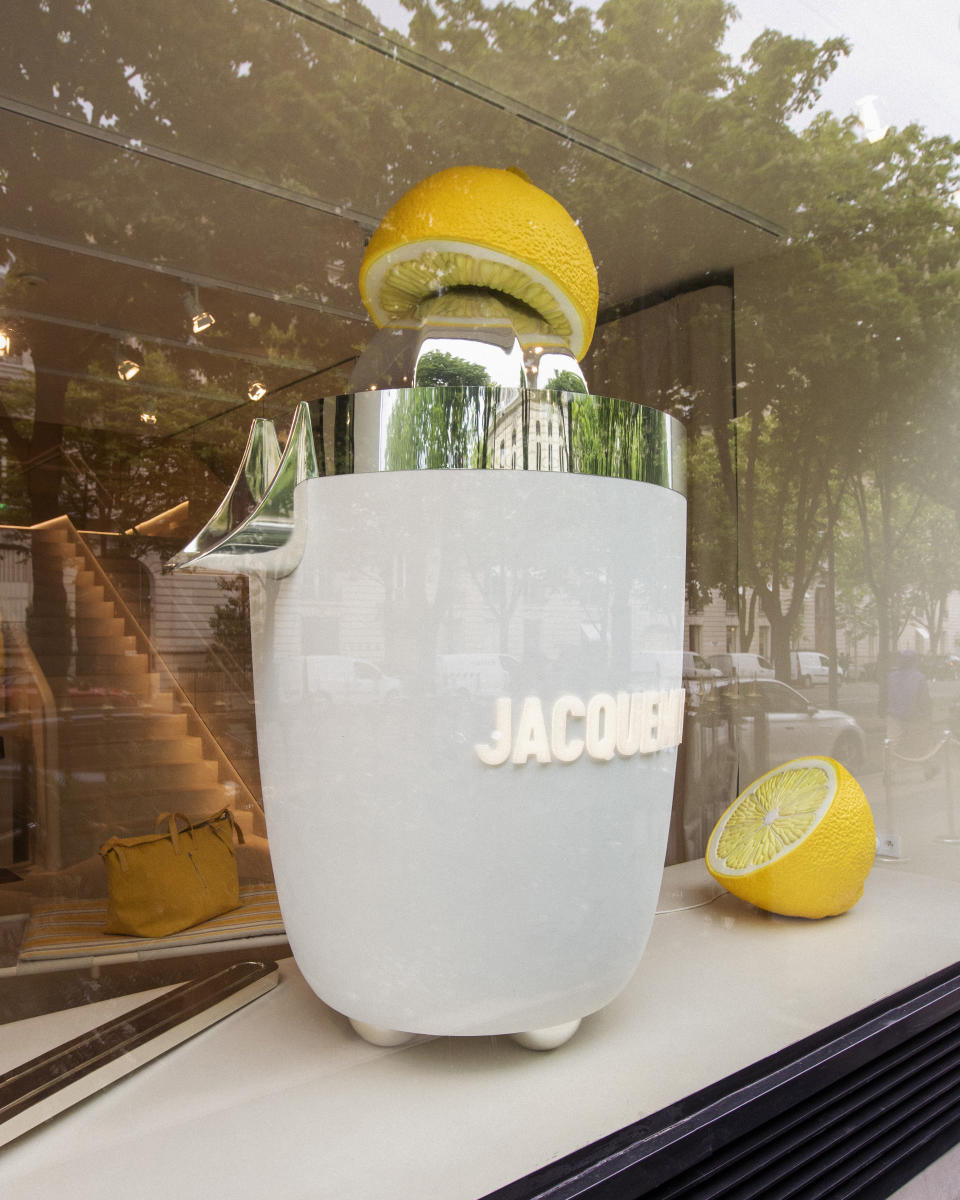A giant juicer in the window of the Jacquemus boutique on Avenue Montaigne in Paris.