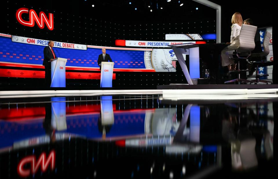 <span>CNN journalists Jake Tapper and Dana Bash (R) moderate the first presidential debate of the 2024 elections between Joe Biden and Donald Trump at the CNN's studios in Atlanta, Georgia, on June 27, 2024</span><div><span>ANDREW CABALLERO-REYNOLDS</span><span>AFP</span></div>