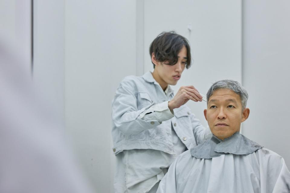 Idekoba gets a haircut in Tokyo. He booked the appointment using a booking app he created during his early days at Recruit. Photographer: Shoko Takayasu/Bloomberg