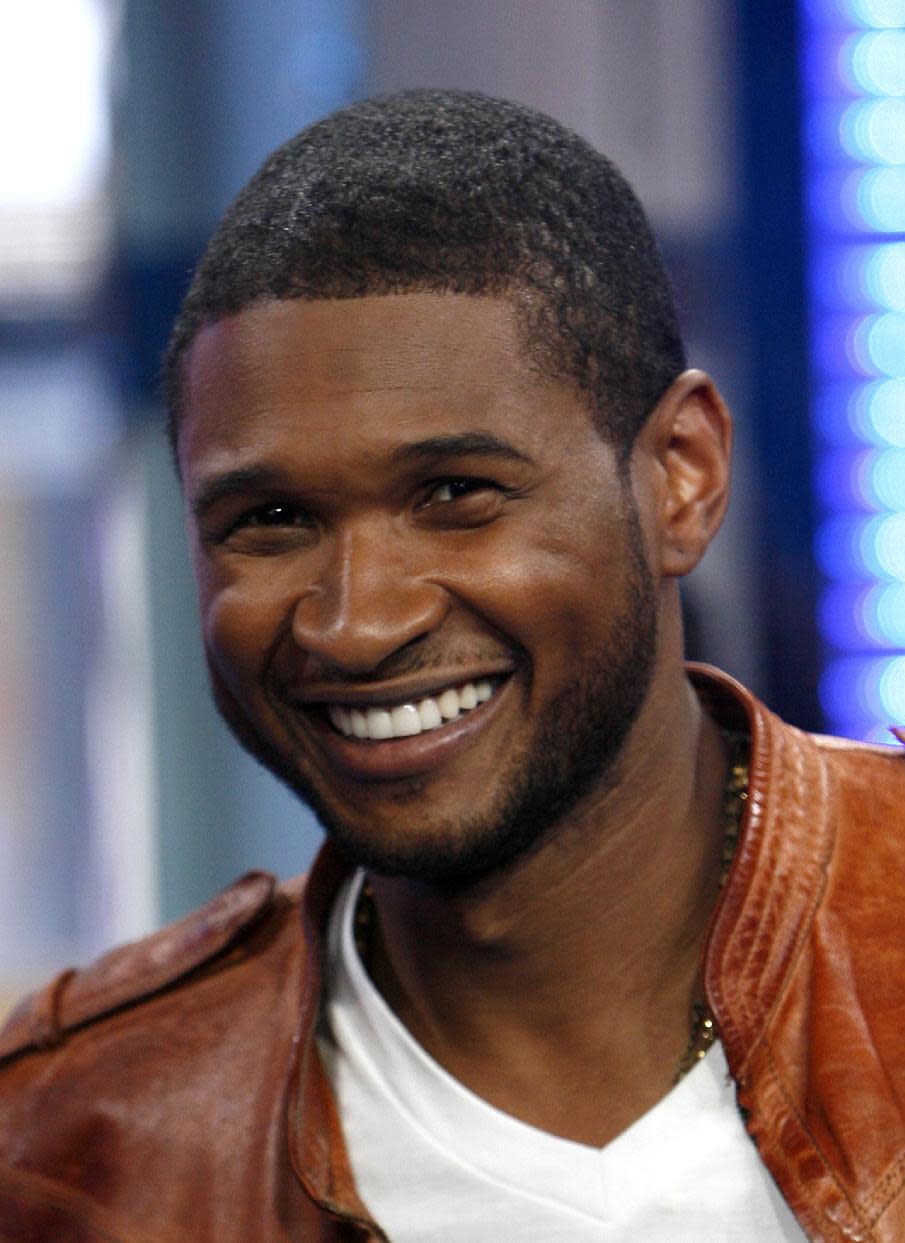 ** FILE ** In this May 27, 2008 file photo, Usher is shown on MTV's Total Request Live in New York. NBC says on Monday, Sept. 17, 2012 that Usher and Shakira are joining "The Voice" as new coaches next spring, when Christina Aguilera and CeeLo Green take a break from the show. (AP Photo/Jason DeCrow, file)