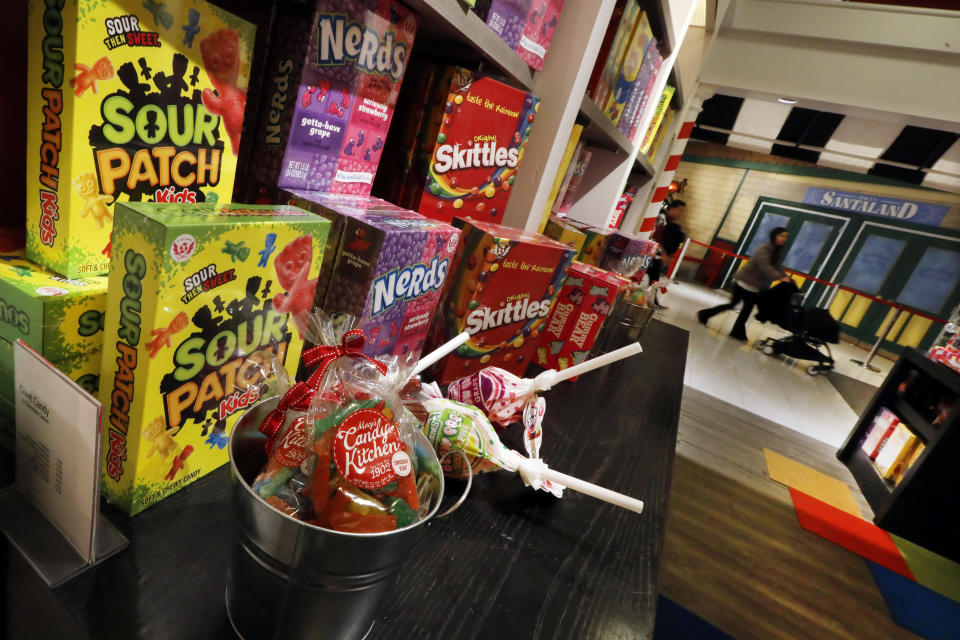 In this Tuesday, Nov. 5, 2019, photo candy is displayed in the Tasty Treats section at the Macy's flagship store, in New York. With three weeks until the official start of the holiday shopping season, the nation’s retailers are gearing up for what will be another competitive shopping period. (AP Photo/Richard Drew)