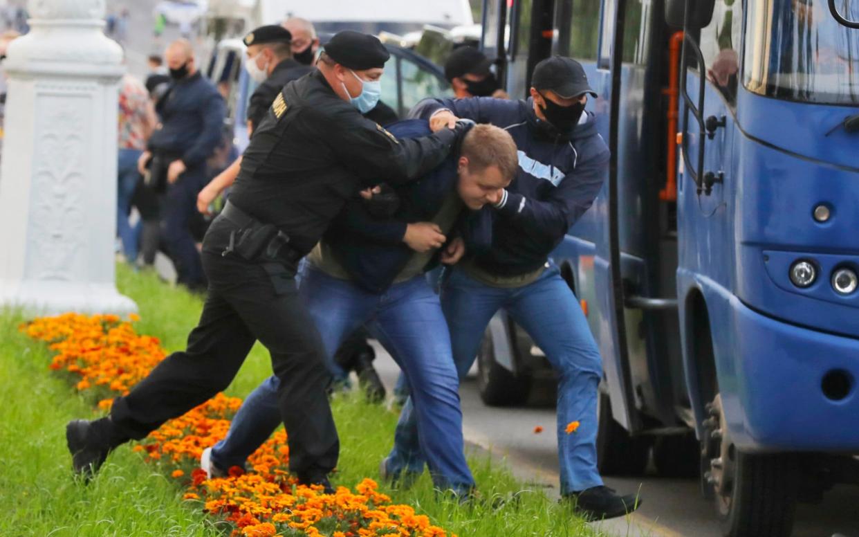 Anti-government protesters were detained in Minsk by police and plainclothes officers - Sergei Grits/AP