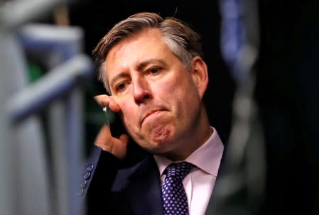 FILE PHOTO: Graham Brady, Chairman of the Conservative Party 1922 Committee, speaks on the telephone after announcing that the Conservative Party will hold a vote of no confidence in the prime minister in Westminster, London