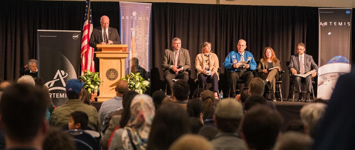 Harlan Spence, Director of the University of New Hampshire Institute for the Study of Earth, Oceans, and Space at the podium. Seated from left: Mike Sarafin, Artemis mission manager, NASA; Kristin Morgan, assistant manager SLS, Liquid Engines Office, NASA; Lee Morin, NASA astronaut (and UNH alum); Rosemary Sargent, Artemis II mission manager, Orion Spacecraft, Lockheed Martin; and Richard Taylor, senior electrical design engineering manager, Jacobs.