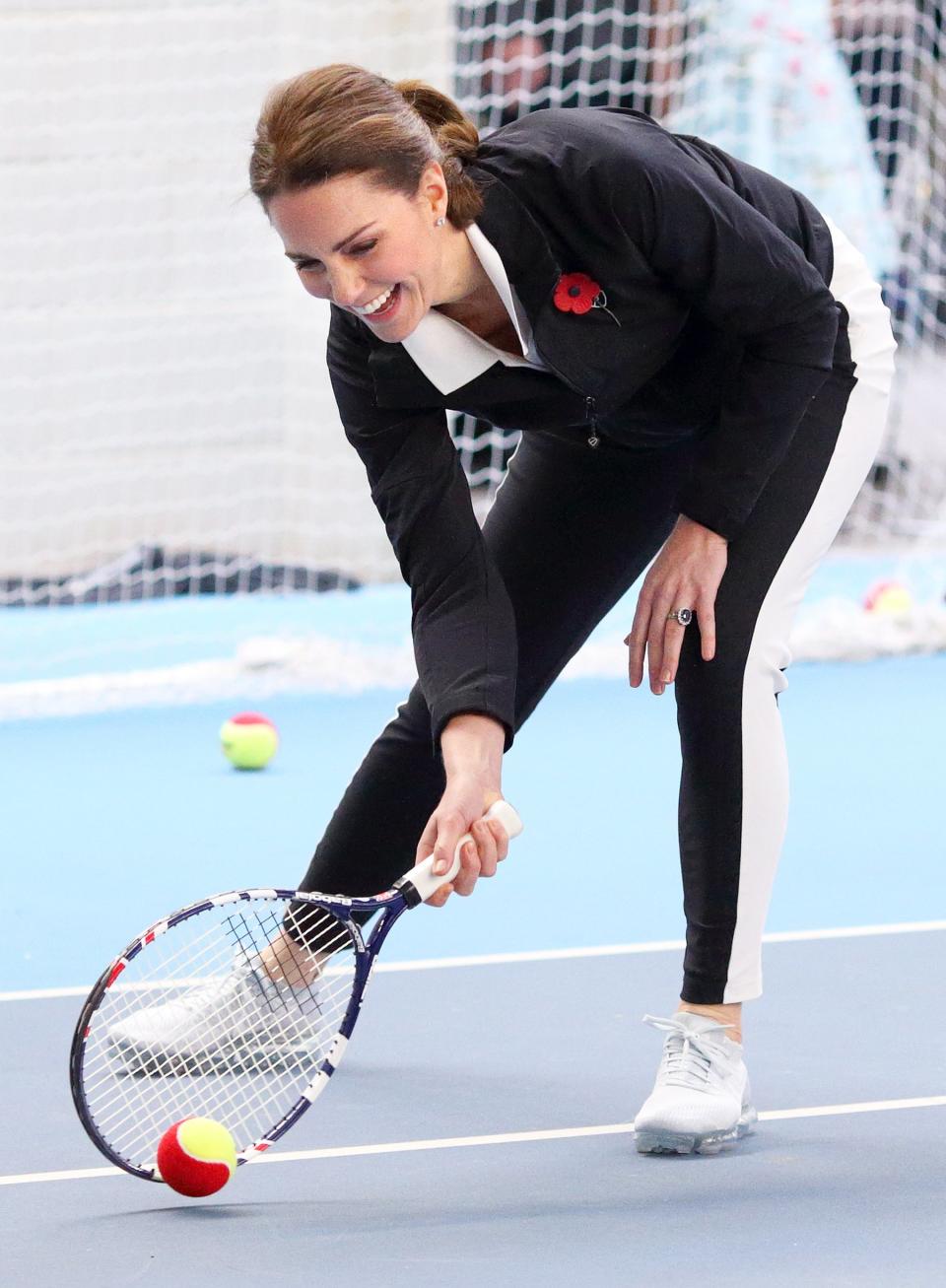 The Wimbledon regular was all smiles during a visit to the Lawn Tennis Association at the National Tennis Centre in Oct. 2017. She rocked grey sneakers for the occasion, paired with black and white athletic pants, a polo shirt and a pullover sweater.