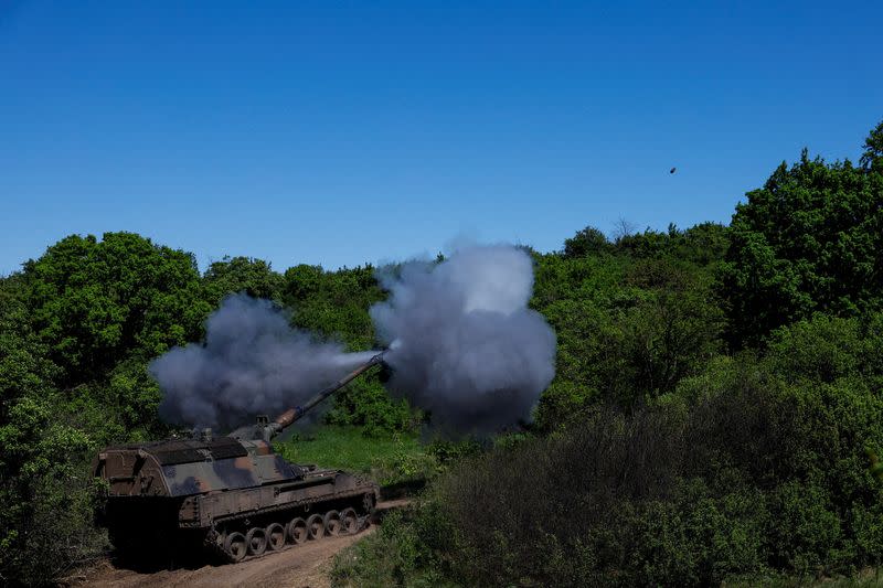 FILE PHOTO: Ukrainian servicemen fire a Panzerhaubitze 2000 self-propelled howitzer toward Russian troops in Donetsk region