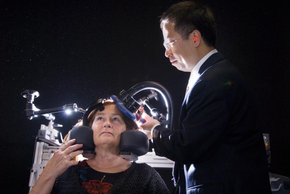 <div class="inline-image__caption"><p>Lucinda Smith, a former teacher who has struggled with depressive episodes since childhood, is treated with transcranial magnetic stimulation by UC Davis physician Dr. Gouhua Xia. </p></div> <div class="inline-image__credit">Florence Low/Getty</div>