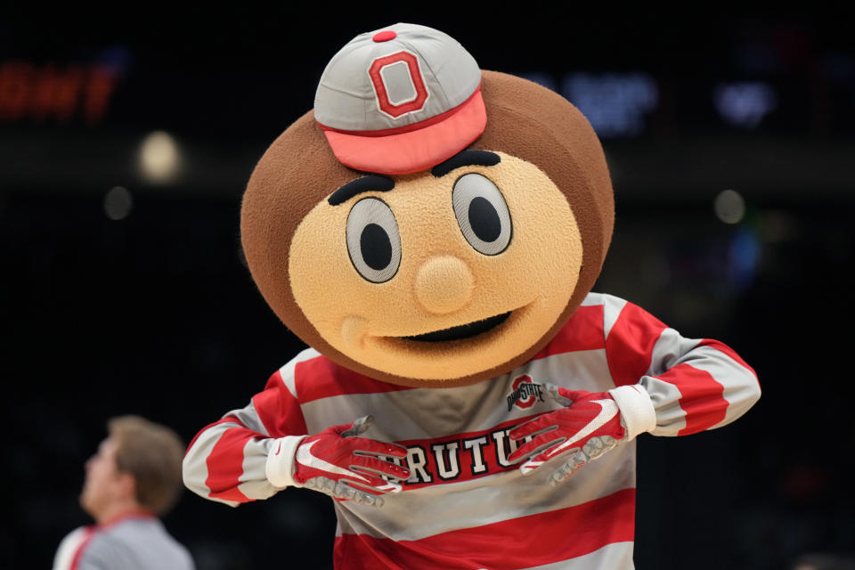 March 27, 2023; Seattle, Washington; Brutus Buckeye gestures during the third quarter between the Virginia Tech Hokies and the Ohio State Buckeyes at Climate Pledge Arena. Kirby Lee-USA TODAY Sports