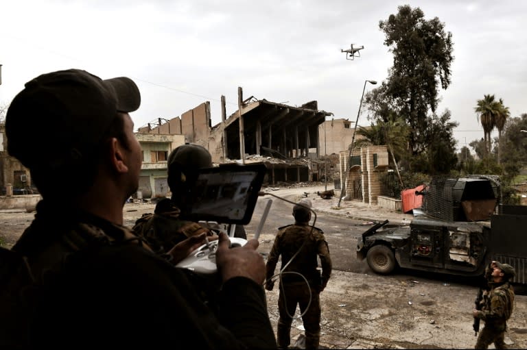 Members of Iraqi forces fly a drone to spot positions of Islamic State group jihadists in the northern Iraqi city of Mosul on March 13, 2017