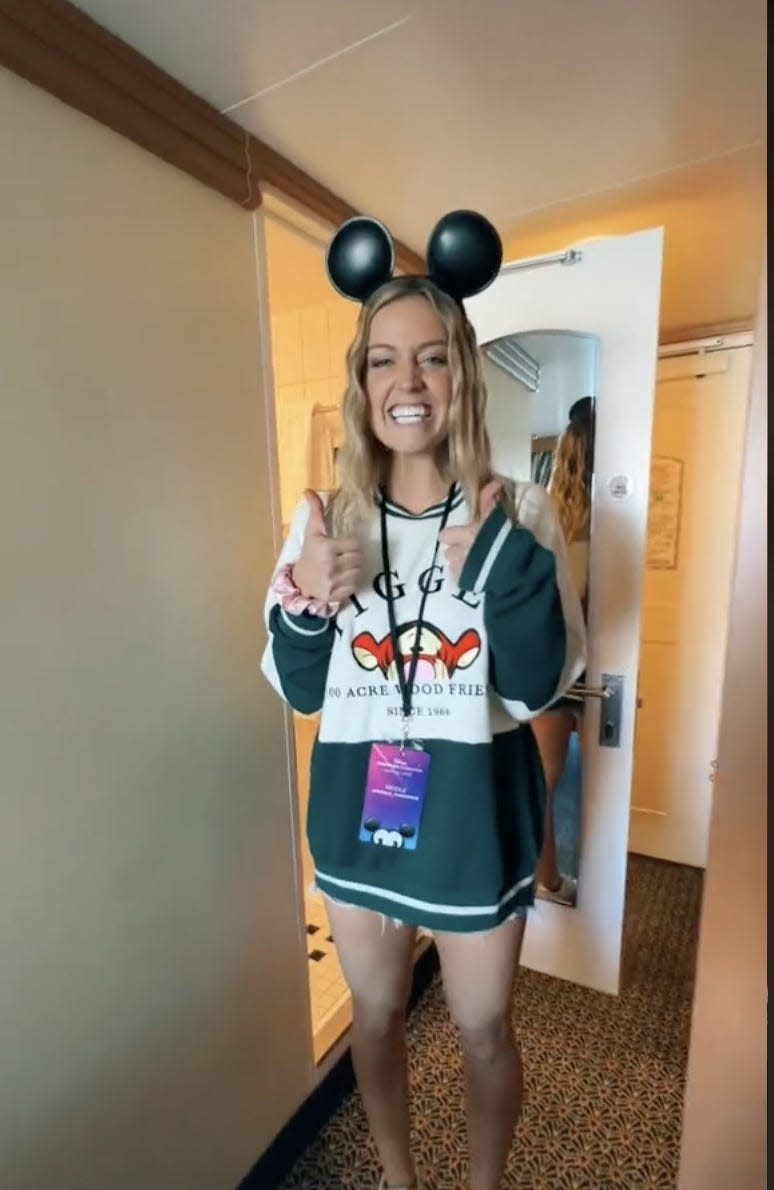 A picture of Nicole wearing Mickey Mouse ears.