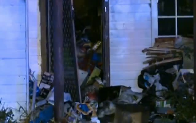 Access to the house was blocked by large piles of items and rubbish. Source: 7 News.