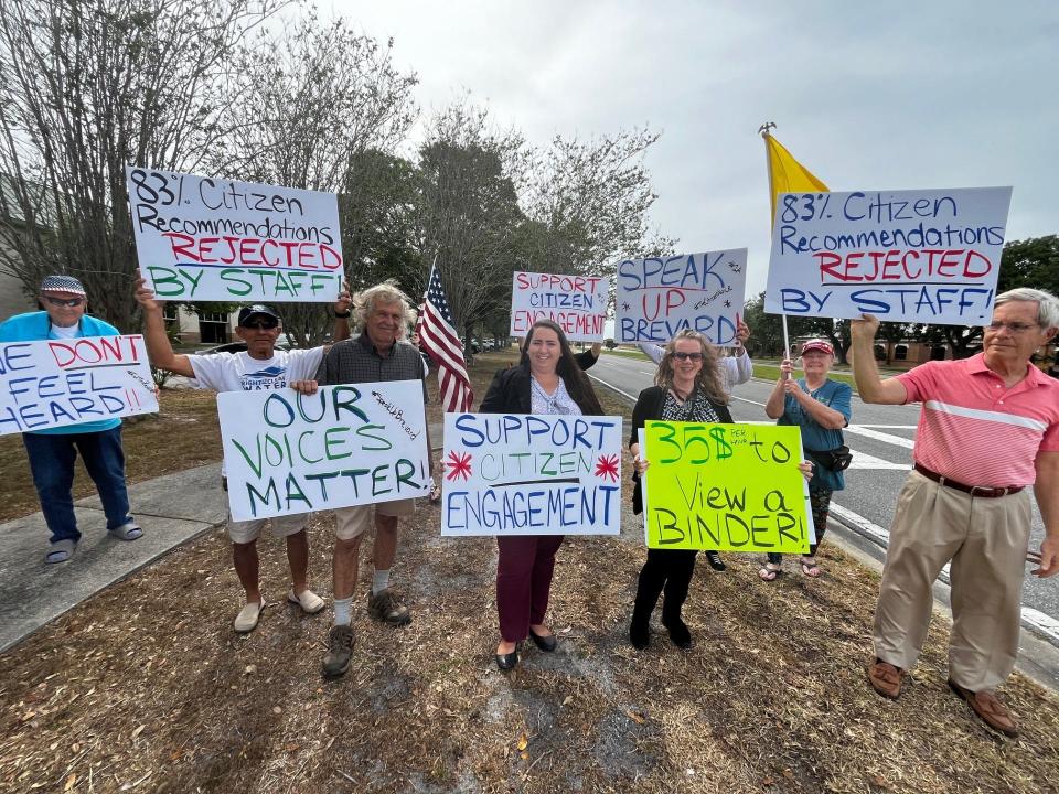 A group of sign-carrying Brevard County residents held a rally Tuesday afternoon outside the Brevard County Government Center to demonstrate their concerns about the Speak Up Brevard process for citizen input.