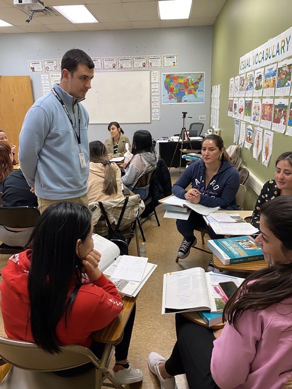 An ESL class in session at the UCEDA Institute in Paterson with teacher Tyler Poeti talking to students. Founded by a family of immigrants who moved to North Jersey the institute will celebrate its 35th anniversary this month.
