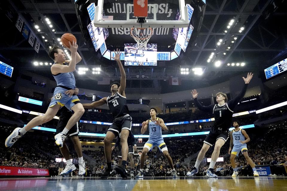 Marquette's Tyler Kolek looks to pass during the first half of an NCAA college basketball game against Georgetown Friday, Dec. 22, 2023, in Milwaukee. (AP Photo/Morry Gash)