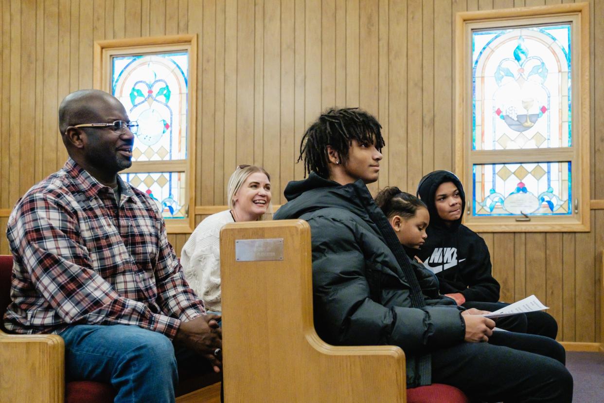 Rasheed As-Samad, his wife, Jessica, and their sons, Andre, Isaiah and Rasheed Jr. (left to right) speak about their feelings over the reading of the "Adventures of Huckleberry Finn" in a New Philadelphia High School English class on Jan. 25 at First Baptist Church in Dover. In response to the family's complaint, the district has removed from the curriculum a version of the book that uses a racial slur more than 200 times.